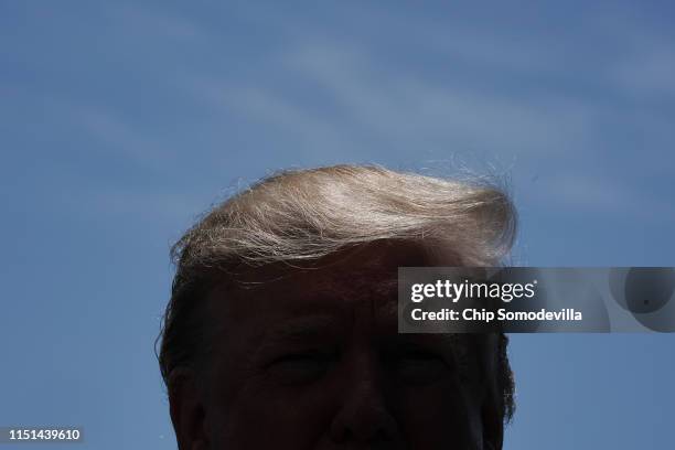 President Donald Trump talks to reporters while departing the White House May 24, 2019 in Washington, DC. Trump is traveling to Japan where,...