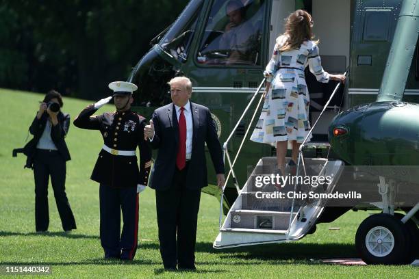 President Donald Trump gives a thumbs-up as first lady Melania Trump boards Marine One on the South Lawn of the White House May 24, 2019 in...