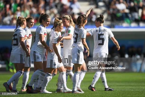 Sara Daebritz of Germany celebrates his scoring with team mates during the Women's World Cup match between Germany and Nigeria at Stade des Alpes on...