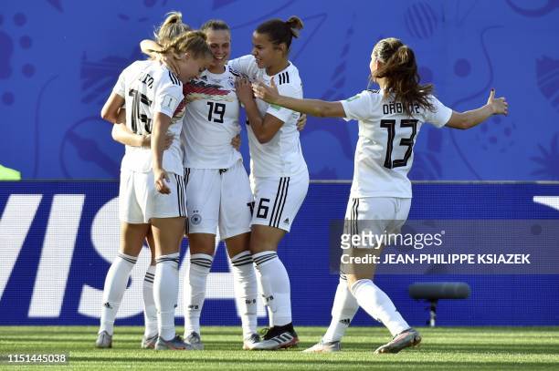 Germany's midfielder Lea Schuller is congratulated by teammates after scoring a goal during the France 2019 Women's World Cup round of sixteen...