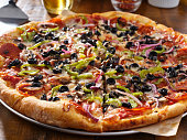 tasty supreme pizza with olives peppers onions and sausage