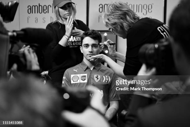 Charles Leclerc of Monaco and Ferrari prepares for the Amber Lounge Fashion Show during previews ahead of the F1 Grand Prix of Monaco at Circuit de...