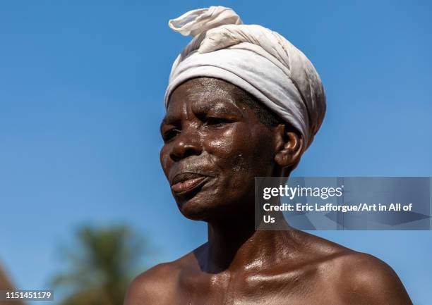 Dan tribe senior woman dancing during a ceremony, Bafing, Gboni, Ivory Coast on May 5, 2019 in Gboni, Ivory Coast.