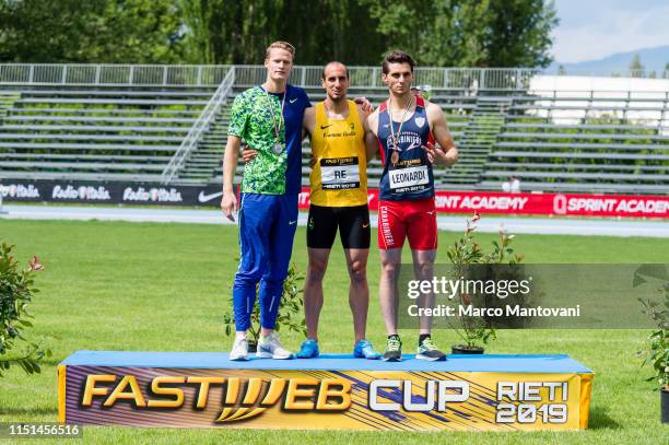 Luka Janezic , Davide Re and Giuseppe Leonardi pose on the podium after the men's 400m final race during the Riunione Italiana di Velocità athletic...
