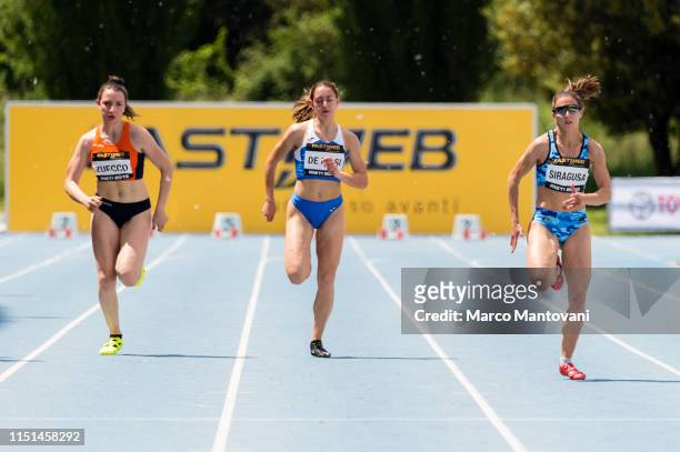 Margherita Zuecco, Arianna De Masi and Irene Siragusa compete in the women's 100m heat race during the Riunione Italiana di Velocità athletic meeting...