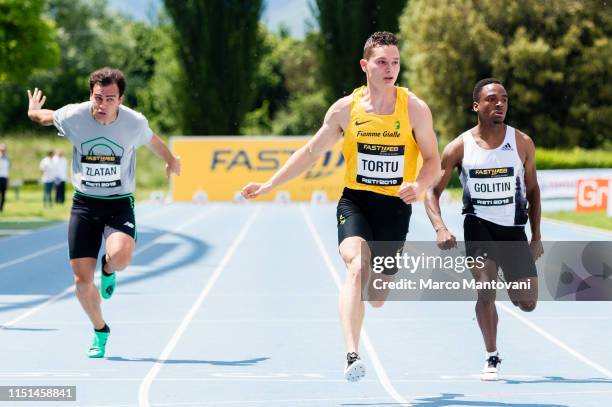 Andrei Alexandru Zlatan, Filippo Tortu and Amaury Goitlin compete in the men's 100m heat race during the Riunione Italiana di Velocità athletic...