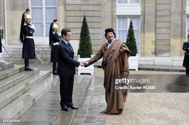 French president Nicolas Sarkozy welcomes Libyan leader Moamer Kadhafi at the French Elysee Palace in Paris, France on December 10, 2007 - French...