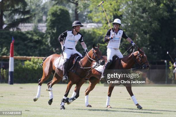 Harry, Duke of Sussex and Nacho Figueras, of Team Sentebale St Regis celebrate during the Sentebale ISPS Handa Polo Cup between Team U.S Polo Assn...