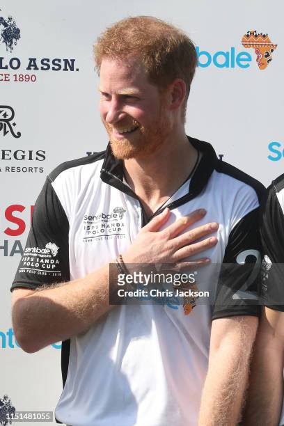 Harry, Duke of Sussex of Team Sentebale St Regis smlies at the prizegiving after victory in the Sentebale ISPS Handa Polo Cup at Roma Polo Club on...