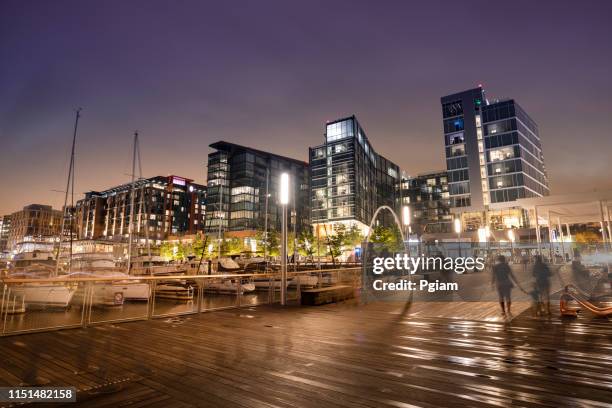 district wharf entertainment area at night in washington dc usa - washington dc downtown stock pictures, royalty-free photos & images