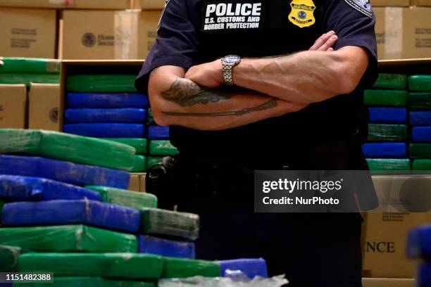 Law enforcement officials present a part of the evidence from a cocaine bust on the MSC Gayane in the port of Philadelphia, during a press conference...