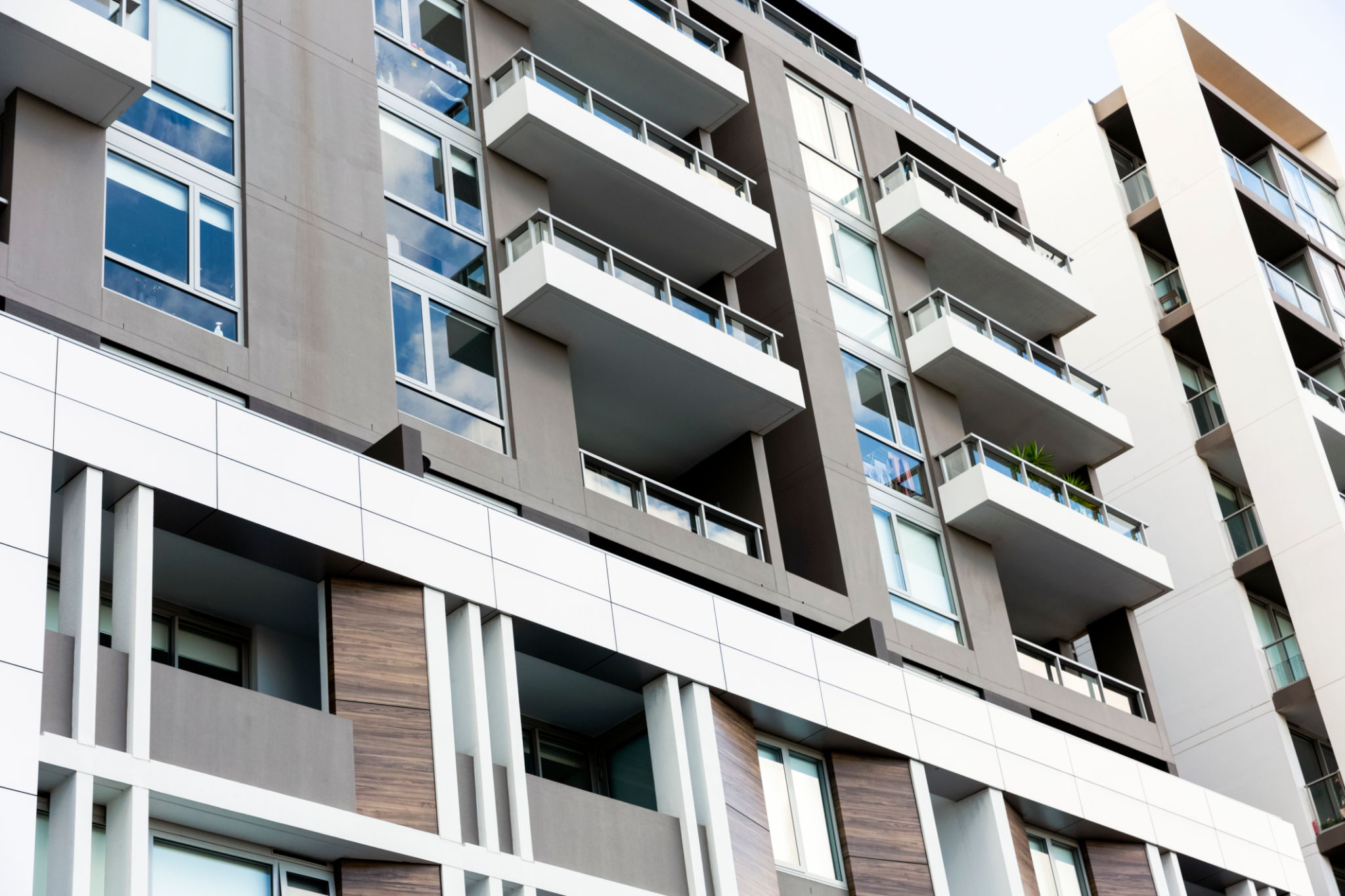 Low angle view of modern residential building, background with copy space Low angle view of modern residential building, background with copy space