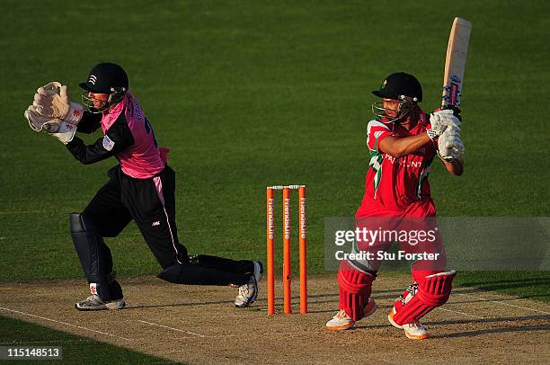 Glamorgan batsman Alviro Petersen hits out as Middlesex keeper Jon Simpson looks on during the Friends Life T20 match between Glamorgan and Middlesex...