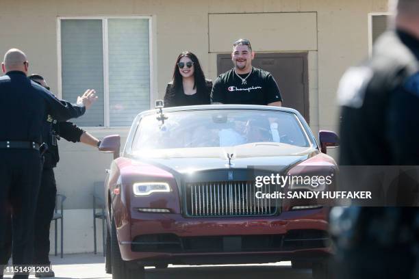 Heavyweight boxing champion Andy Ruiz Jr. And his wife Julie Ruiz wave to supporters during a parade in his honor on Saturday, June 22, 2019 in...