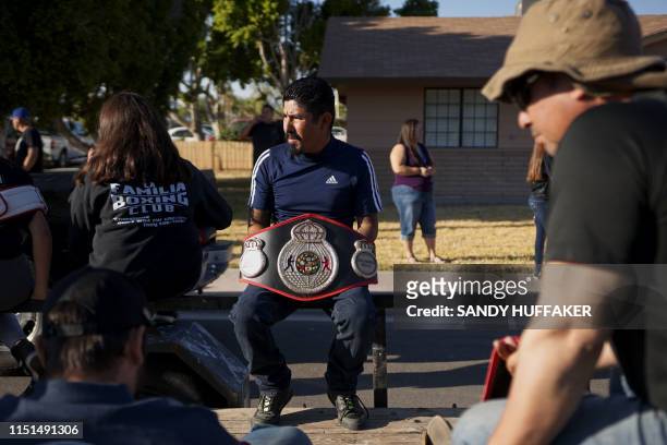 Parade goer holds a boxing tite belt before the start of a homecoming parade in honour of Heavyweight boxing champion Andy Ruiz Jr. On June 22, 2019...