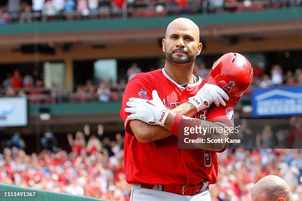 Albert Pujols of the Los Angeles Angels of Anaheim gives fans a curtain call after hitting a solo home run during the seventh inning against the St....