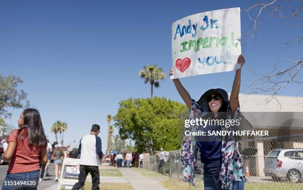 Fan cheers on Heavyweight boxing champion Andy Ruiz Jr. During a parade in his honour on June 22, 2019 in Imperial, California. - Boxer Andy Ruiz...