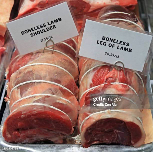retail display of raw boneless lamb meat on tray with price tag - leg of lamb stock pictures, royalty-free photos & images