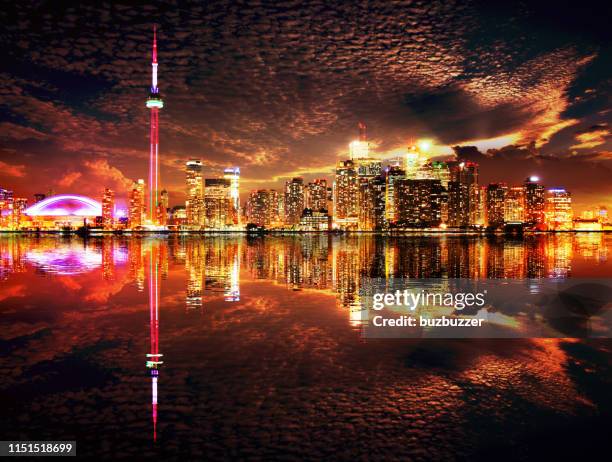 majestic toronto city skyline with water reflection - dusk stock pictures, royalty-free photos & images