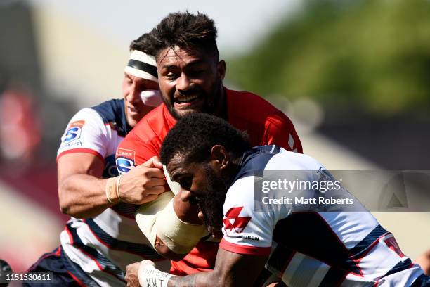 Amanaki Lelei Mafi of the Sunwolves is tackled during the Super Rugby match between Sunwolves and rebels at the Prince Chichibu Memorial Ground on...