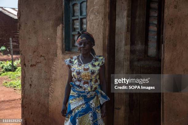 Felicite, a schoolteacher, watches as her home is being decontaminated after a pastor living in the house tested positive for Ebola in Beni. The DRC...
