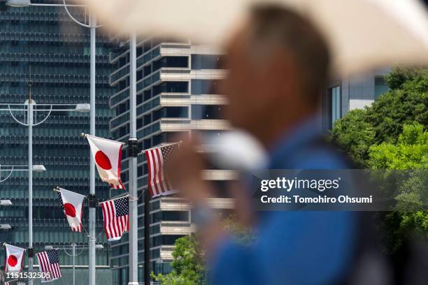 And Japanese national flags are displayed on a street on May 25, 2019 in Tokyo, Japan. U.S President Donald Trump will arrive later today for a...