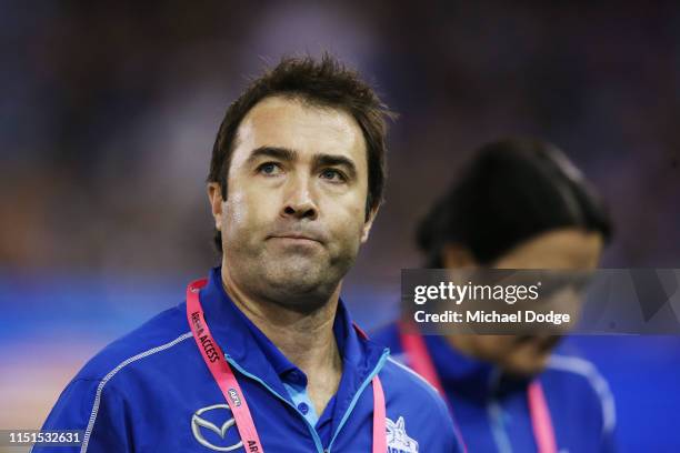 Kangaroos head coach Brad Scott walks off at three quarter time during the round 10 AFL match between the Western Bulldogs and the North Melbourne...