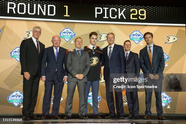 Brayden Tracey poses for a photo onstage after being picked twenty-nine overall by the Anaheim Ducks during the first round of the 2019 NHL Draft at...