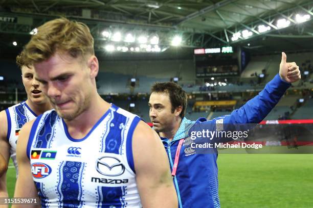 An emotional Kangaroos head coach Brad Scott thanks fans after their win during the round 10 AFL match between the Western Bulldogs and the North...