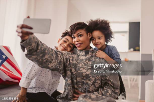 african - american army mom - cell phones for soldiers stock pictures, royalty-free photos & images