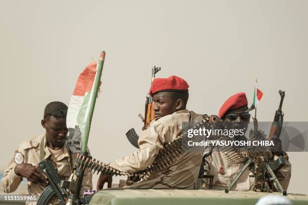 Members of the Rapid Support Forces paramilitaries secure the place for a rally for supporters of Sudan's ruling Transitional Military Council in the...