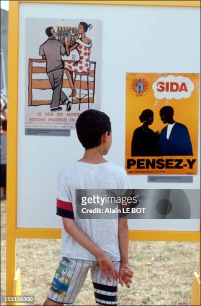 Elisabeth Hubert during the AIDS prevention campaign in Nantes, France on July 28, 1995 - Child at the AIDS poster campaign.