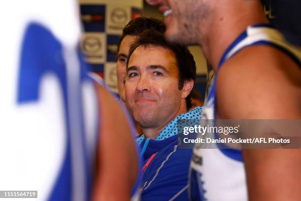Kangaroos head coach Brad Scott is seen in the team circle after the 2019 AFL round 10 match between the Western Bulldogs and the North Melbourne...