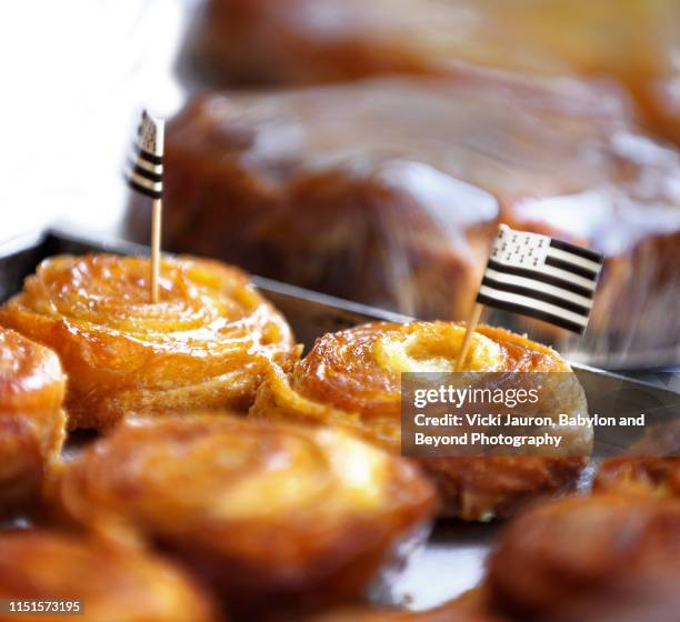 delicious looking pastries in a bakery in port du crouesty with flag of brittany, france - cake flag stock pictures, royalty-free photos & images