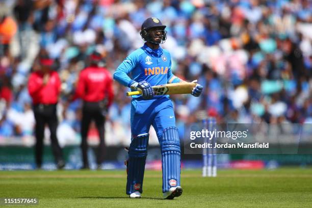 Dinesh Karthik of India walks off after being dismissed by Jimmy Neesham of New Zealand during the ICC Cricket World Cup 2019 Warm Up match between...