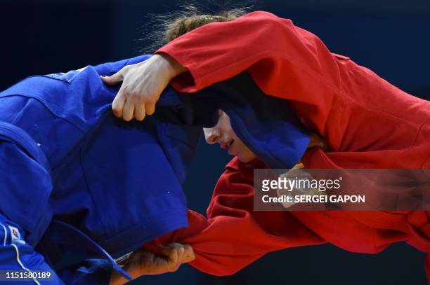 Georgia's Salome Abashidze competes against Moldova's Sabina Artemciuc in the womens sambo under 60 kg category quarterfinal bout at the 2019...