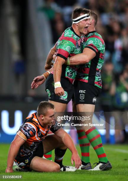 Liam Knight of the Rabbitohs celebrates scoring a try during the round 11 NRL match between the South Sydney Rabbitohs and the Wests Tigers at ANZ...