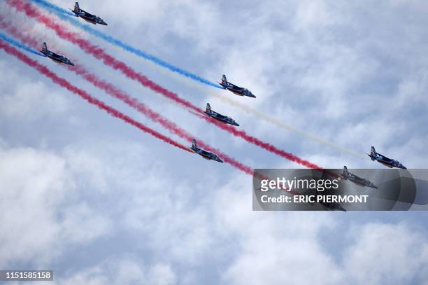 French elite acrobatic flying team "Patrouille de France" performs a flying display on the last day of the International Paris Air Show at Le Bourget...
