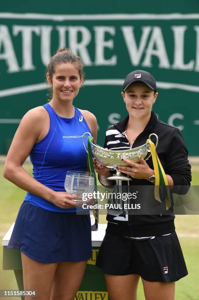 Winner, Australia's Ashleigh Barty and runner-up Germany's Julia Gorges pose for a photograph with their trophies after their women's singles final...