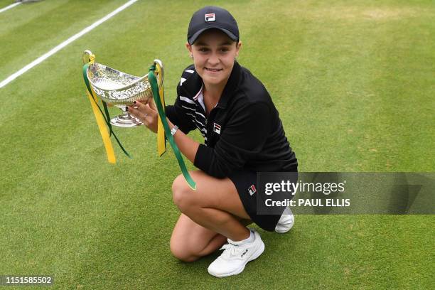 Australia's Ashleigh Barty poses for a photograph with the trophy after her straight sets victory over Germany's Julia Gorges in their women's...