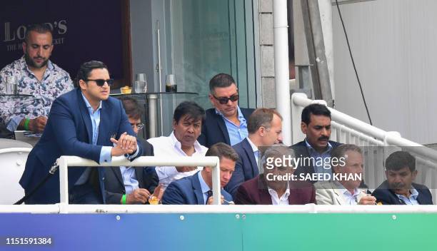 Pakistan Army Chief General Qamar Javed Bajwa looks on with others during the 2019 Cricket World Cup group stage match between Pakistan and South...