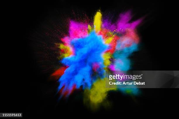 beautiful powder explosion in all directions with vivid colors and black background. - the big bang theory foto e immagini stock