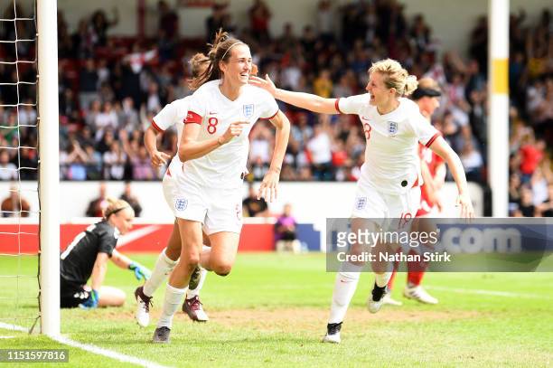 Jill Scott of England celebrates with teammate Ellen White after scoring her team's second goal during the International Friendly between England...