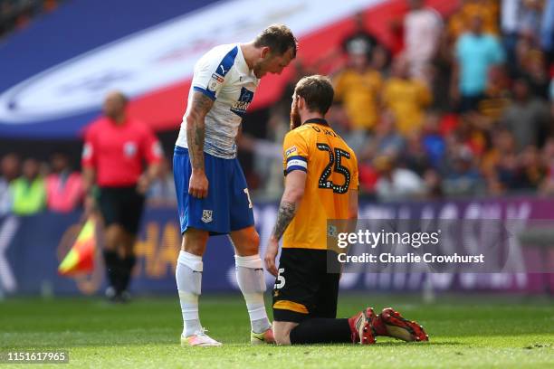 James Norwood of Tranmere Rovers confronts Mark O'Brien of Newport County after a foul by Mark O'Brien which leads to a second yellow, and therefore...