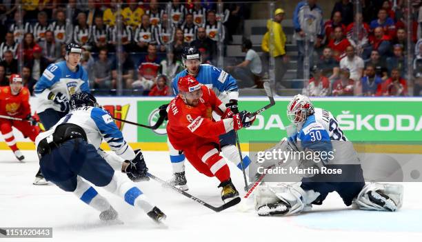 Alexander Ovechkin of Russia challenges KevinLankinen, goaltender of Finland during the 2019 IIHF Ice Hockey World Championship Slovakia semi final...