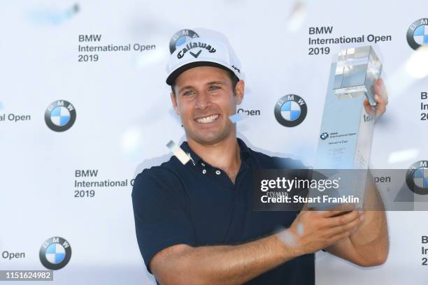 Andrea Pavan of Italy poses with the trophy after his victory during a playoff during day four of the BMW International Open at Golfclub Munchen...