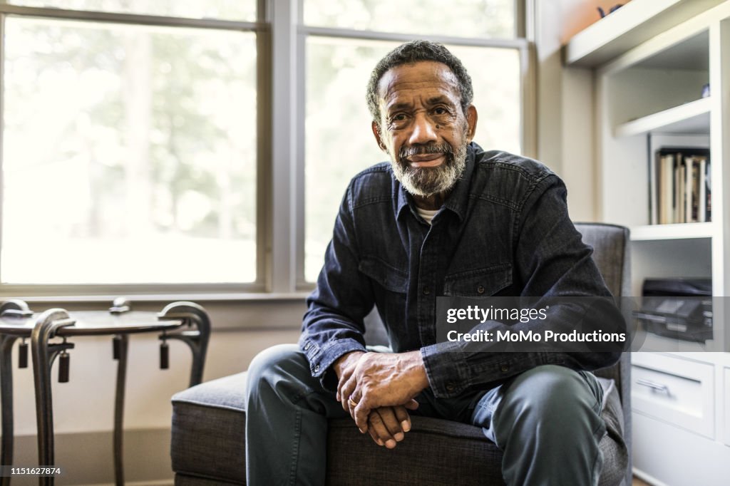 Portrait of senior man at home