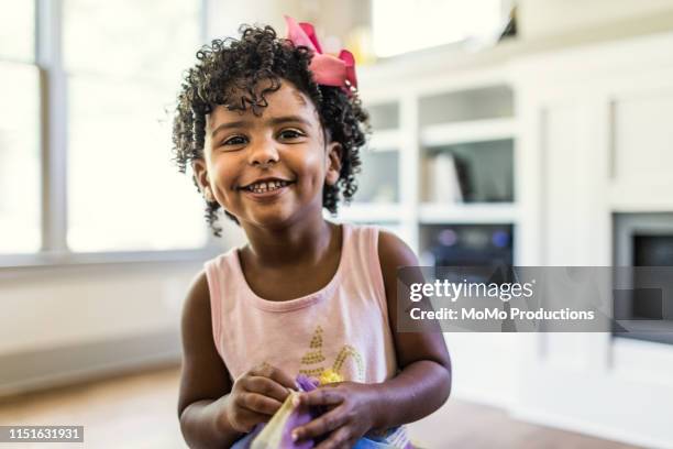 portrait of preschool age girl at home - fossetta foto e immagini stock