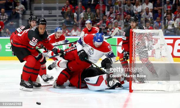 Darnell Nurse of Canada challenges Radek Faksa of Czech Republic during the 2019 IIHF Ice Hockey World Championship Slovakia semi final game between...