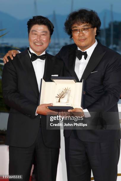 Director Bong Joon-Ho , winner of the Palme d'Or award for his film "Parasite" poses with Actor Kang-Ho Song at the winner photocall during the 72nd...